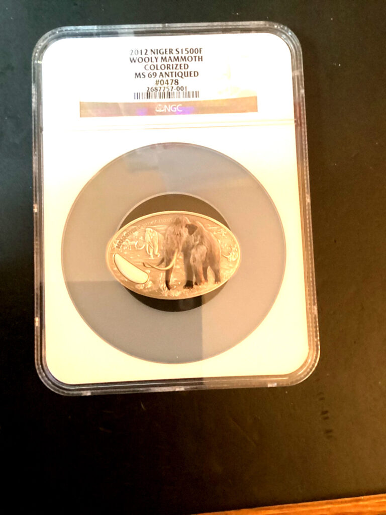 Read more about the article Ivory Coast 1000F + Rare 2012 Niger 1500F Silver Prehistoric Mammoths Graded 69