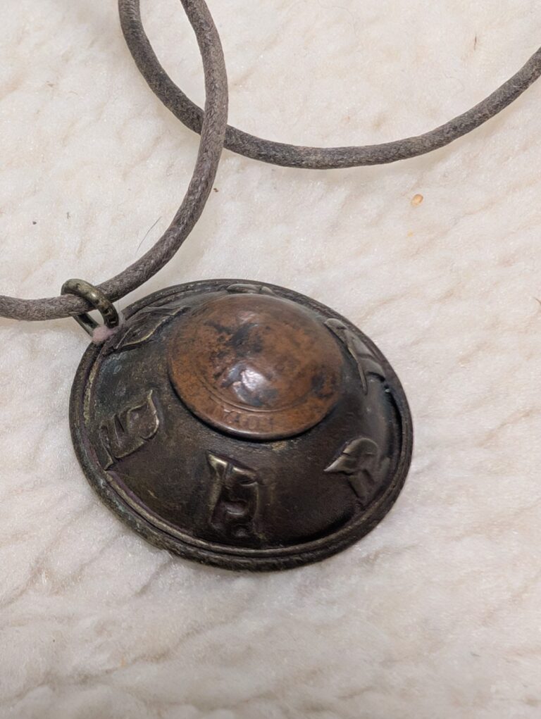 Read more about the article Vintage Copper Pendant Bhutan 1979 Copper Coin Gau Prayer Amulet